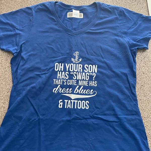 a blue t shirt for navy mom on the floor
