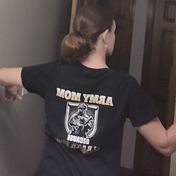 A woman wearing a black t-shirt with 'ARMY MOM' text and graphic design.