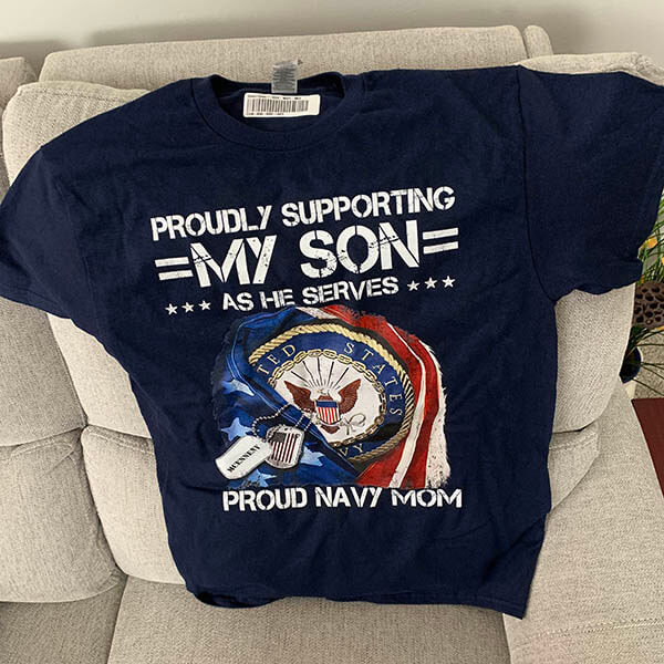 proudly supporting my sailor proud navy mom shirt on a sofa